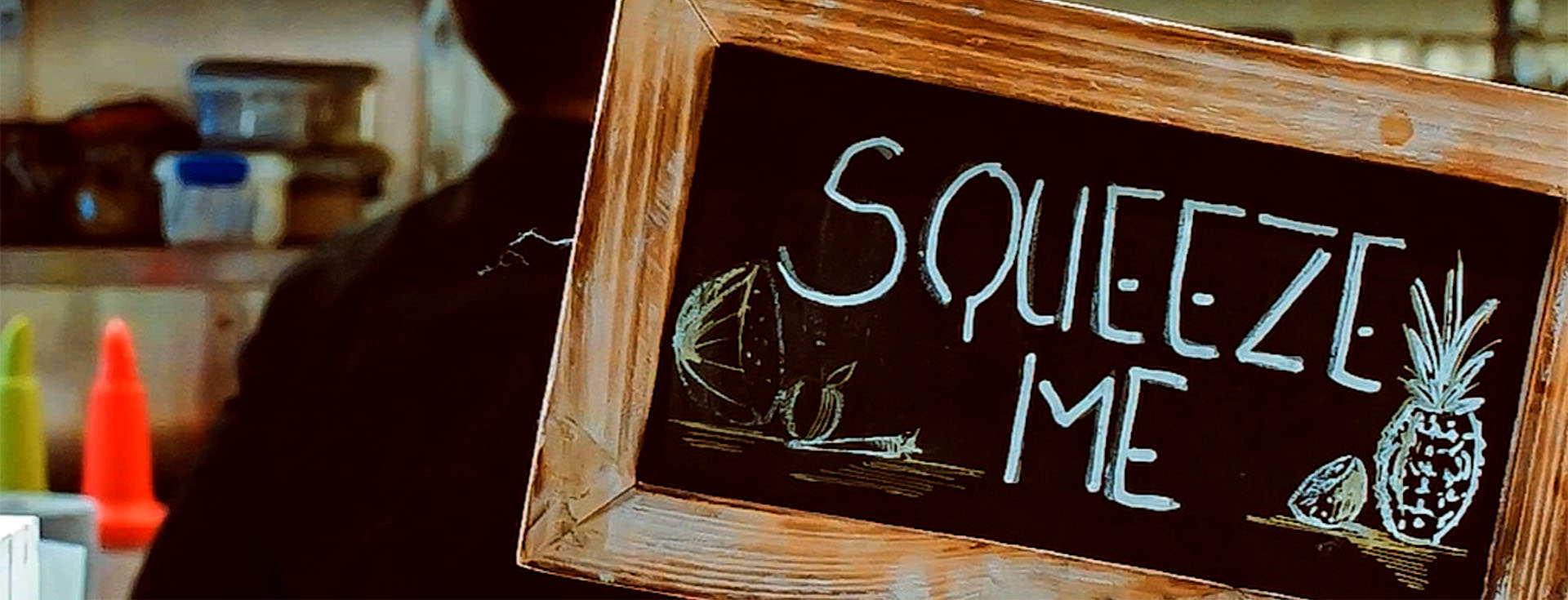 Squeeze me sign on blackboard